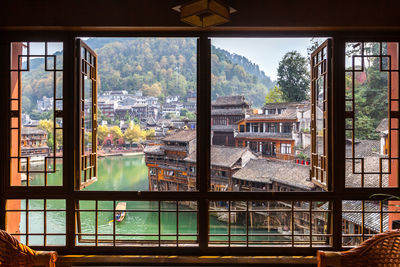 Buildings seen through glass window