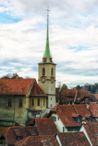 Old building in city against sky