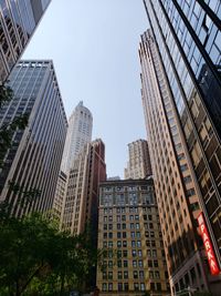 Low angle view of modern buildings against clear sky