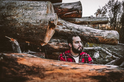 Portrait of young man in forest