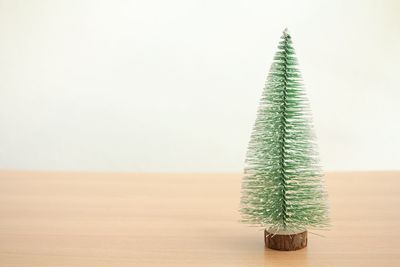 Close-up of christmas tree on table