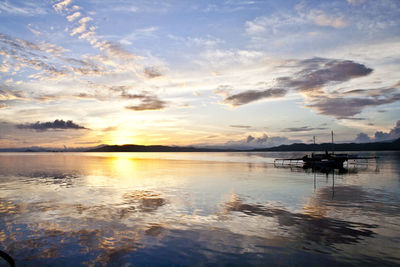 Scenic view of sea against cloudy sky