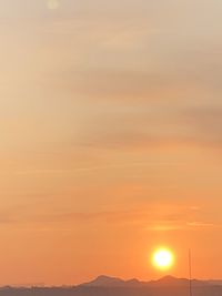 Scenic view of silhouette landscape against romantic sky at sunset