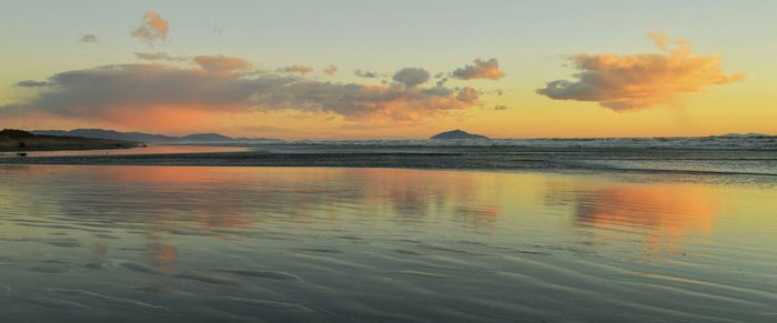 Scenic view of sea at sunset