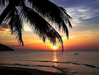 Scenic view of sea against sky at sunset