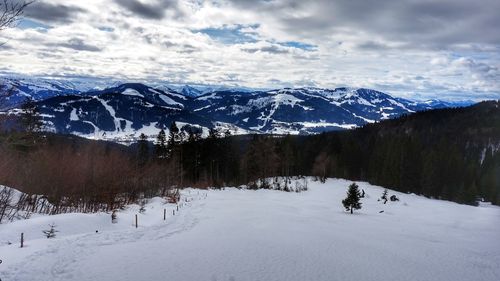 Scenic view of snowcapped mountains against sky