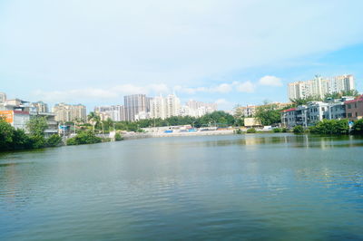 Scenic view of sea and buildings against sky