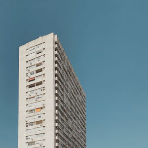 Low angle view of building against clear blue sky