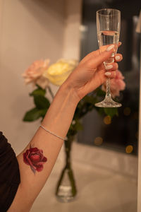 Cropped hand of woman holding wineglass