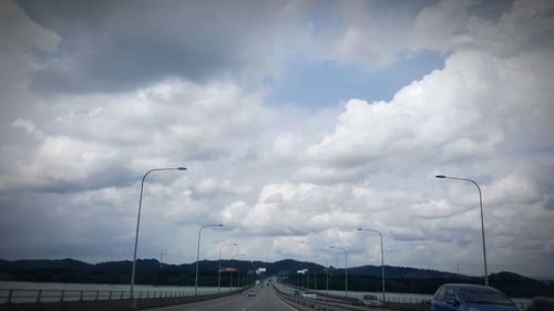 Road against cloudy sky