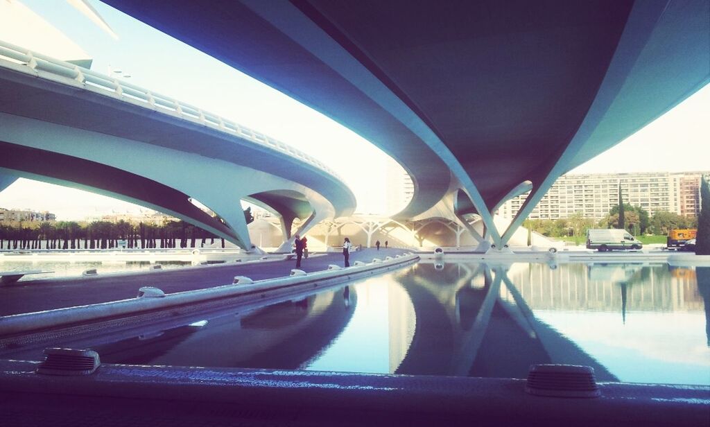 transportation, bridge - man made structure, mode of transport, built structure, architecture, connection, car, land vehicle, water, river, bridge, engineering, travel, reflection, sky, vehicle interior, city, road, day, railing