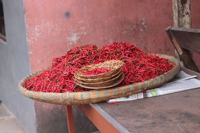 Close-up of red chilies against the wall