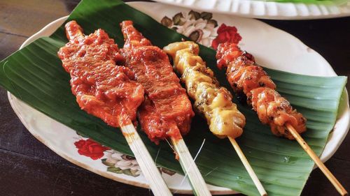 High angle view of meat and leaves on table