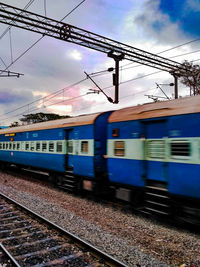 Train against sky in city