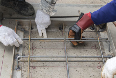 Low section of man working on wood