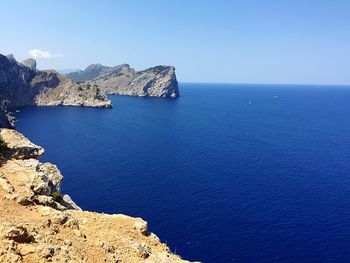 Scenic view of sea against clear blue sky