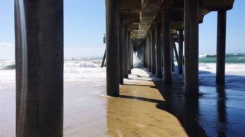 Pier over sea against sky