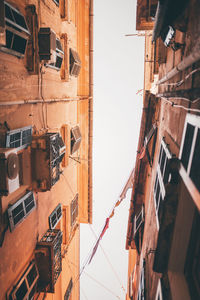 Low angle view of buildings in city against sky