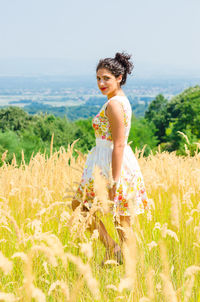 Full length of woman standing on field