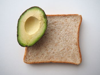 Directly above shot of bread on white background