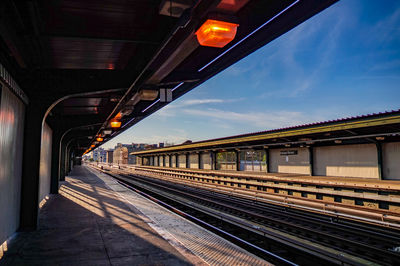 Railroad station platform against sky