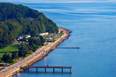 High angle view of sea by trees