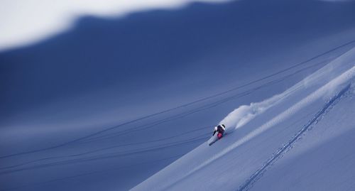 Low angle view of man skiing against sky