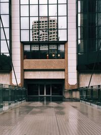 Reflection of building on glass window
