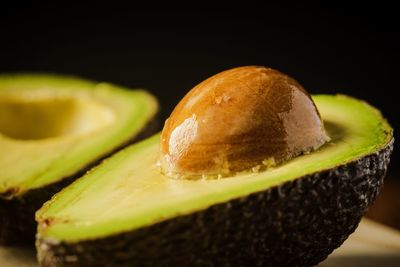 Close-up of lemon slice over black background