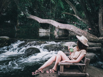 Woman sitting in a forest