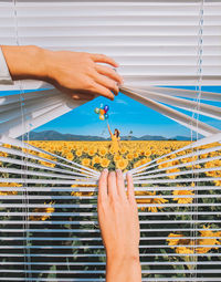Cropped hand of person holding jigsaw piece