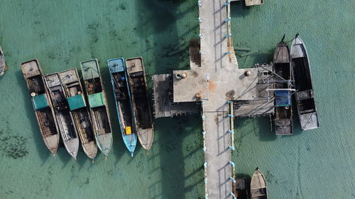 Boats moored at harbor