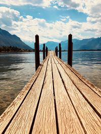 Pier over lake against sky