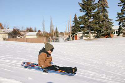 Man skiing on snow covered landscape