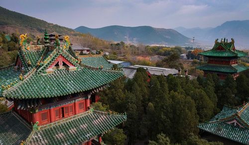 Panoramic view of temple and building against sky