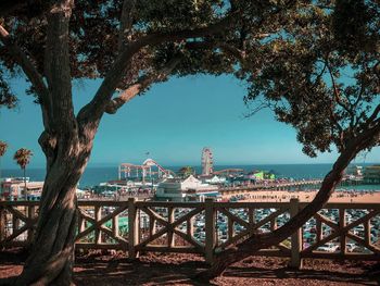 Scenic view of sea and trees against sky