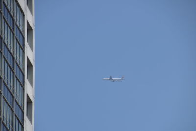 Low angle view of airplane flying in sky