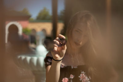 Portrait of woman photographing