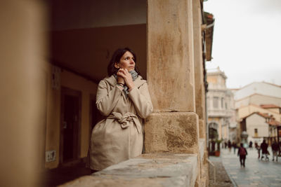 Full length of woman using mobile phone