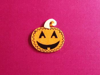 Close-up of smiley face on purple background