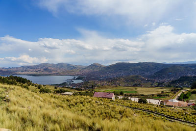 Scenic view of mountains against cloudy sky