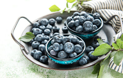 Freshly picked blueberries on a wooden background. concept for healthy eating