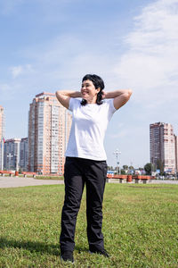 Full length of man standing on field against sky