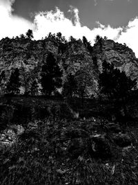 View of rocks against cloudy sky