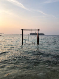 Ocean swing at sunset