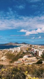 High angle view of townscape by sea against sky las palmas gran canary