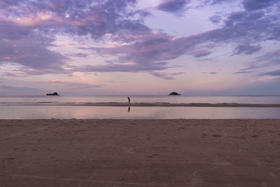 Scenic view of beach against sky during sunset