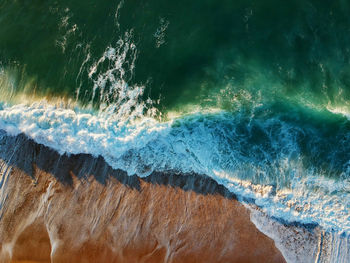 Sand beach aerial, top view of a beautiful sandy beach aerial