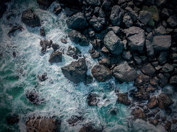 Full frame shot of rocks in sea