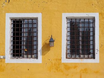 Low angle view of yellow window on building